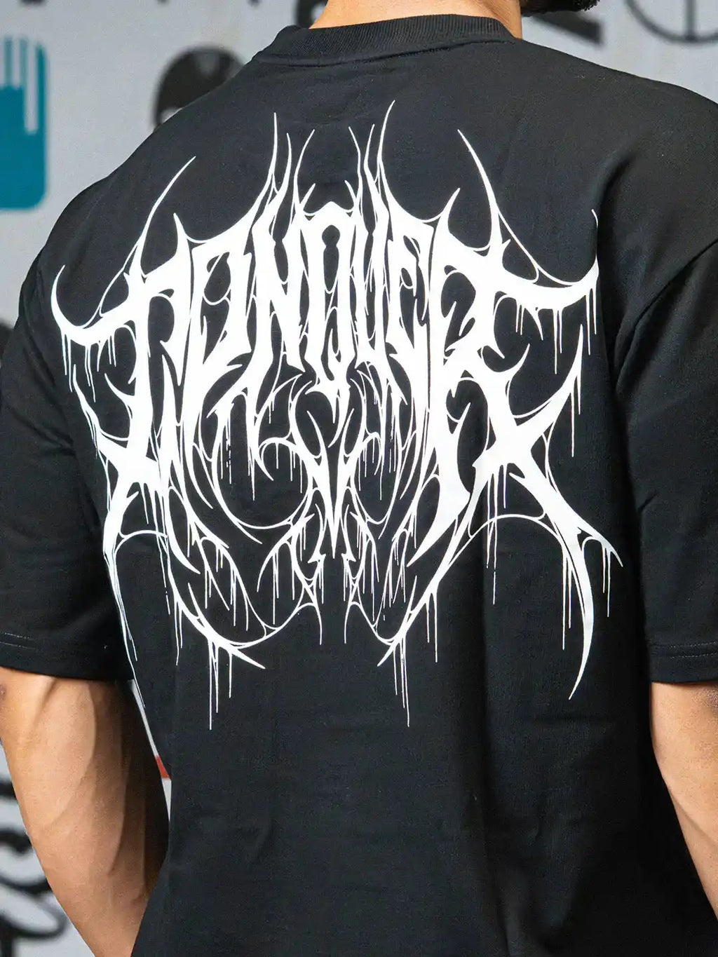Back view of black athletic t-shirt with bold white graphic design print