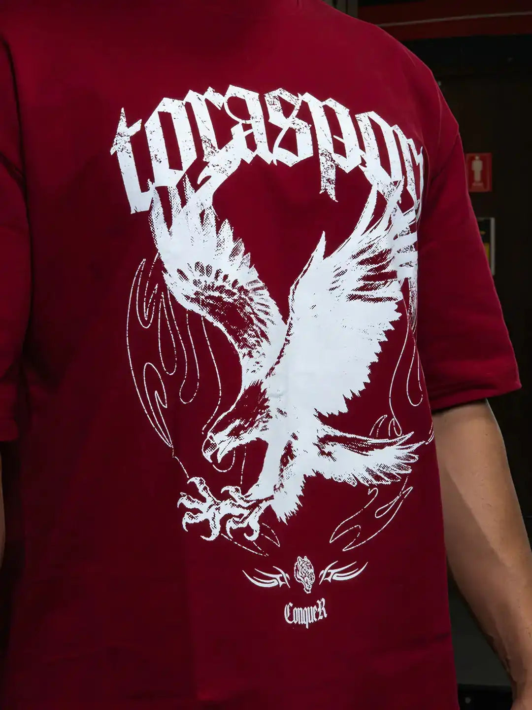 Maroon athletic t-shirt with bold white eagle graphic and gothic text, gym wear style