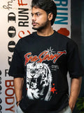 Man wearing black gym t-shirt with bold roaring tiger graphic and motivational text